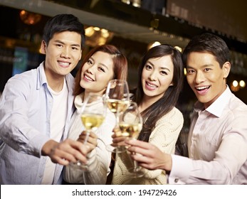 Young Asian Friends Couples Enjoying Party In Pub.