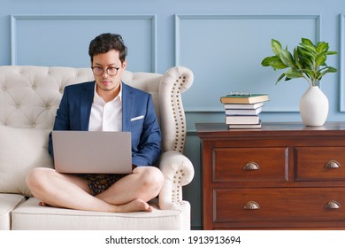 Young Asian Funny Businessman Wearing Underwear Boxer Work At Home And Virtual Video Conference Meeting With Colleagues Business People, Online Working, Video Call At Home Office