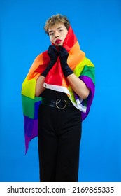 Young Asian Gay Man With Pride Flag Posing On The Blue Screen Background.