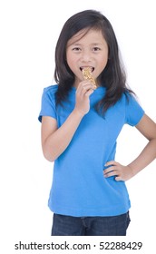 A Young Asian Girl Eating A Granola Bar