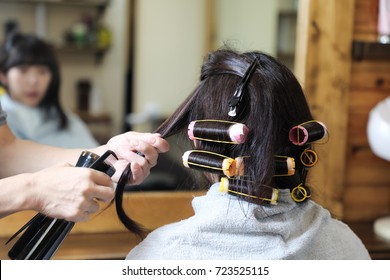 Young Asian Girl In Hair Salon.