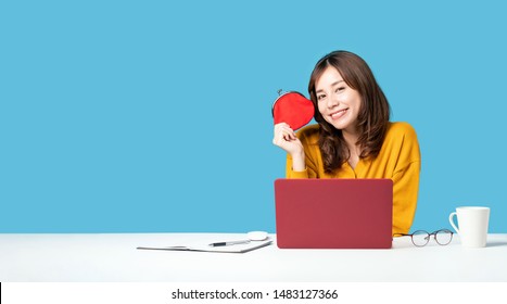 Young Asian Girl Holding A Coin Purse. Making Money.