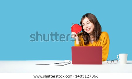 Young asian girl holding a coin purse. Making money.