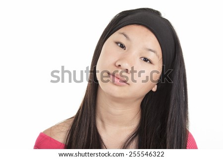 A young asian girl, isolated on studio white background