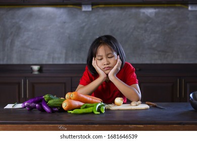 Young Asian Girl Look At Vegetable With Bored Face, Hate Vegetable And Failue Cooking Concept.