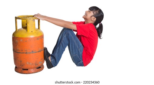 Young Asian Girl Moving An Old Cooking Gas Propane Cylinder Over White Background