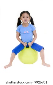 A Young Asian Girl On A Hopping Ball. Isolated