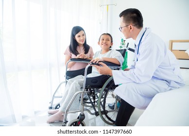 Young asian girl patient and mother smiling while doctor come to visit  - Powered by Shutterstock