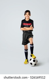 Young Asian Girl Playing Soccer, Isolated Over White