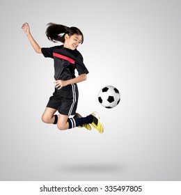 Young asian girl soccer player, Isolated on grey background