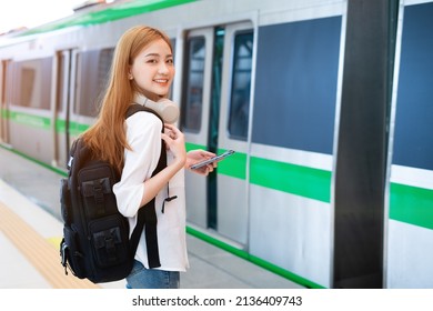 Young Asian Girl Waiting For The Train At The Station
