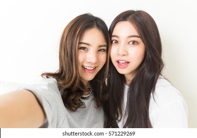 Young Asian Girls smiling for the camera