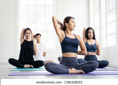 Young Asian Group Sporty Attractive People Learning Yoga Lesson With Coach Trainer. Instructor Woman Leading Exercise Pose, Healthy Lifestyle In Fitness Studio. Sport Gymnastics, Ballet Dancing Class.