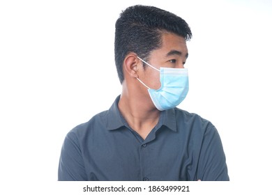 Young Asian Guy Wears Face Mask Isolated On White Background