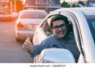 Young Asian Handsome Man Smiling And Showing Thumbs Up In His Car