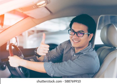 Young Asian Handsome Man Smiling And Showing Thumbs Up In His Car