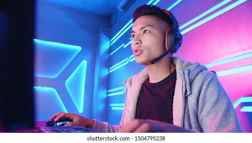 Young Asian Handsome Pro Gamer Having Live Stream And Playing In Online Video Game