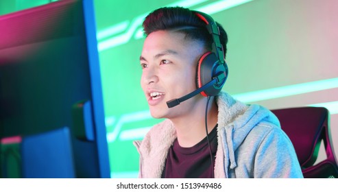 Young Asian Handsome Pro Gamer Having Live Stream And Playing In Online Video Game