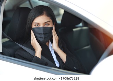 Young Asian Healthy Woman In Business Black Suit With Protect Mask For Healthcare In Automobile And Driving Car. New Normal And Social Distancing Concept