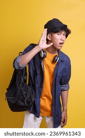 Young Asian male in casual style showing listening gesture  - Shutterstock ID 2369961343