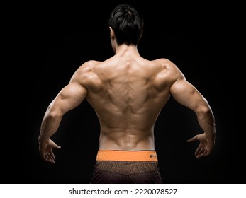 Young Asian Male Fitness Model Poses On Studio Over Dark Background On 18 November 2015. Photo By Victor Fraile