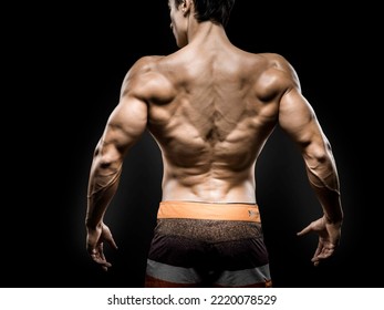 Young Asian Male Fitness Model Poses On Studio Over Dark Background On 18 November 2015. Photo By Victor Fraile