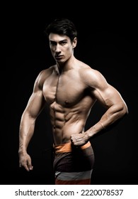 Young Asian Male Fitness Model Poses On Studio Over Dark Background On 18 November 2015. Photo By Victor Fraile