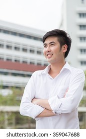 Young Asian Male Looking Up To The Sky