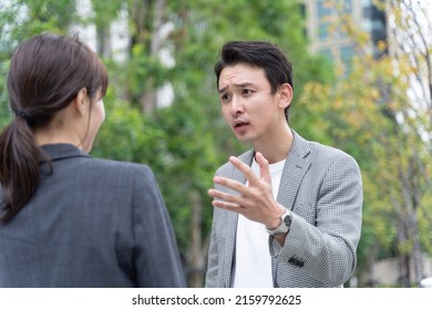 young asian man arguing with woman - Powered by Shutterstock