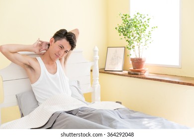 young asian man in the bed room - Shutterstock ID 364292048