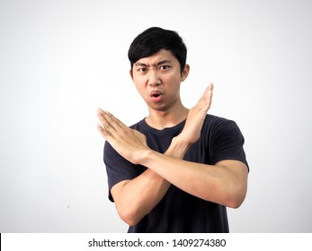 Young Asian Man Black Shirt Cross Arm Disagree Say No Looking At Camera On White Isolate Background