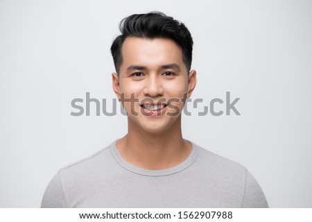 Young Asian man close up shot isolated on white