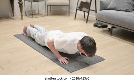 Young Asian Man Doing Pushups At Home