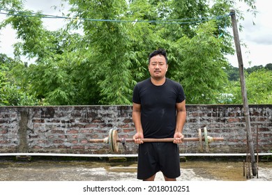 Young Asian Man Doing Work Out At Home. Work Form Home 