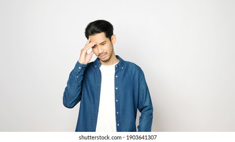 Young Asian Man Doubting While Standing Over Isolated Grey Background, Portrait Of Confused Handsome Asia Guy, People Negative Gusture Expression 