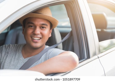 Young Asian Man Driving Car