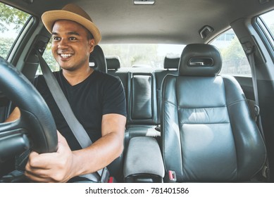 Young Asian Man Driving Car.