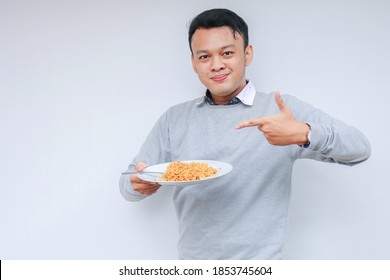 Young Asian Man Enjoy Noodles. Eating Lunch Concept.