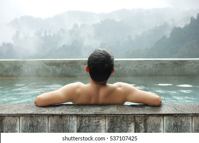 Young Asian Man Enjoying Outdoor Bathing In Winter.