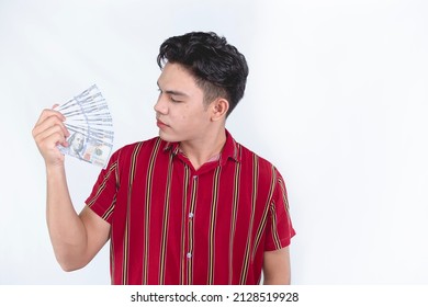 A Young Asian Man Flaunting His Money. Wearing A Red Striped Shirt. Earning A Lot Of Money With His Business.