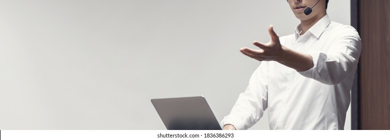 Young Asian Man Giving A Presentation In A Conference Room