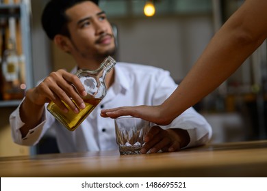 Young Asian Man Has Been Stop For Drinking Alcohol May Be Because Of During Quit Alcohol Period Or It Is Illegal To Drive Vehicle After Drink Alcohol.