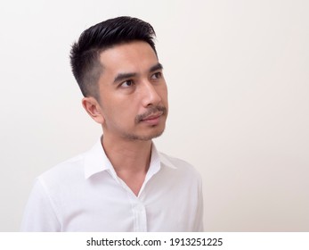 Young Asian Man Isolated On White Background Looking Sideways