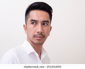 Young Asian Man Isolated On White Background Looking Sideways