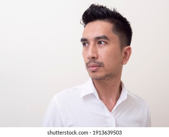 Young Asian Man Isolated On White Background Looking Sideways