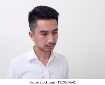 Young Asian Man Isolated On White Background Looking Sideways