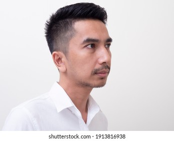 Young Asian Man Isolated On White Background Looking Sideways