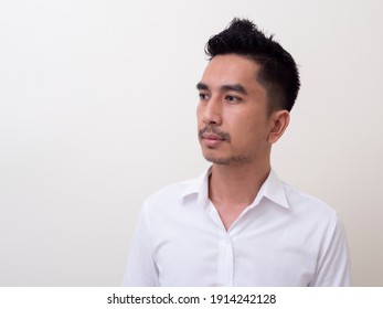 Young Asian Man Isolated On White Background Looking Sideways