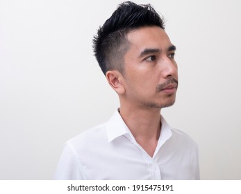 Young Asian Man Isolated On White Background Looking Sideways