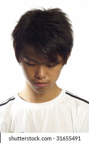 Young Asian Man Looking Down